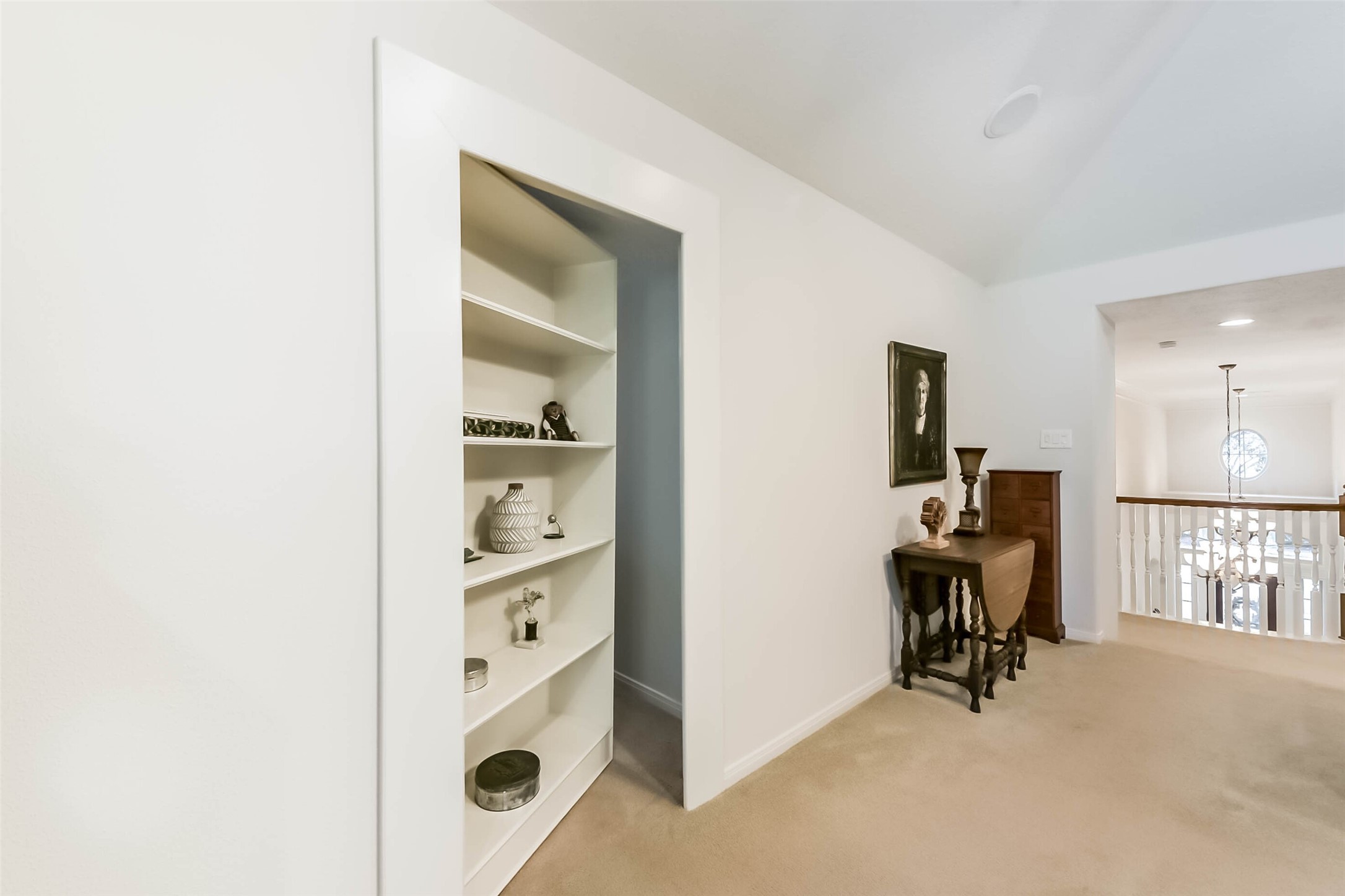 25295 Bull Ridge Drive Porter, TX 77365 - Photo 31 of 50 Custom built-in bookshelf opens to reveal hidden storage — a unique feature of this David Powers Custom Home