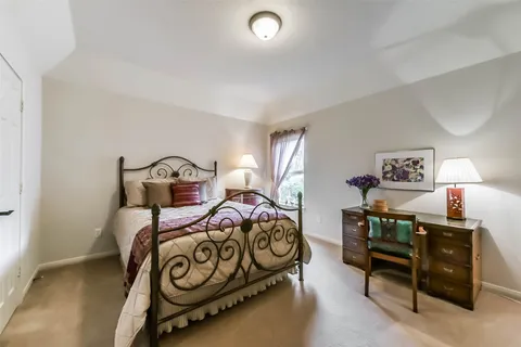 a bathroom with a sink double vanity and a mirror