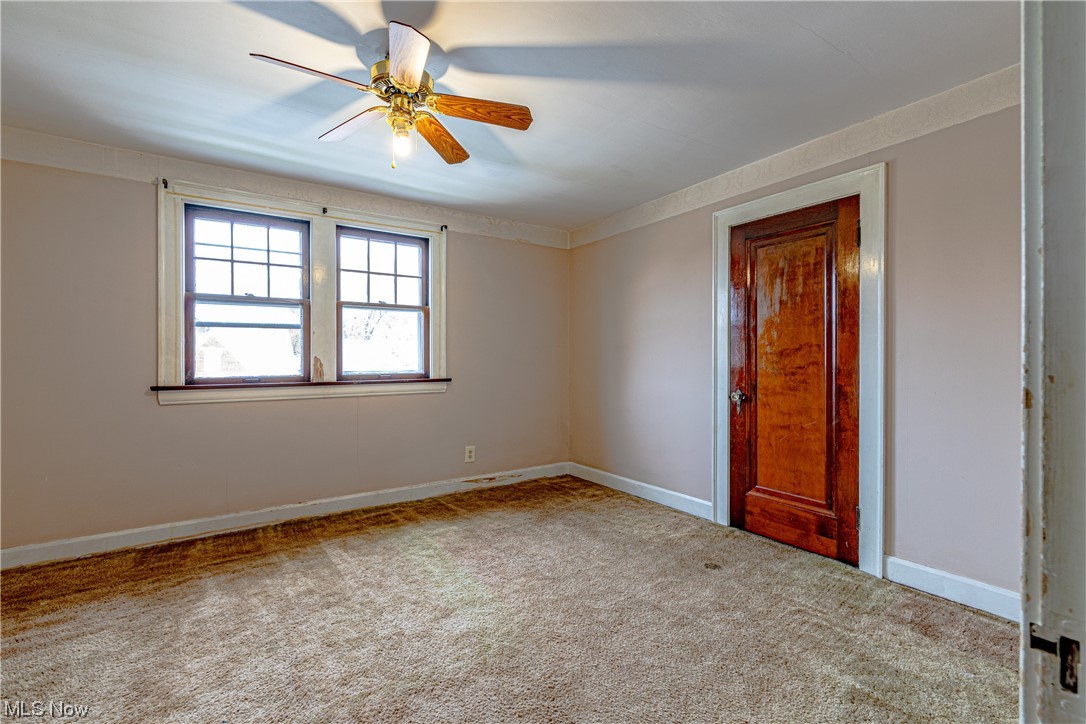 3337 Ralph Avenue Cleveland, OH 44109 - Photo 20 of 30 Carpeted empty room with ceiling fan