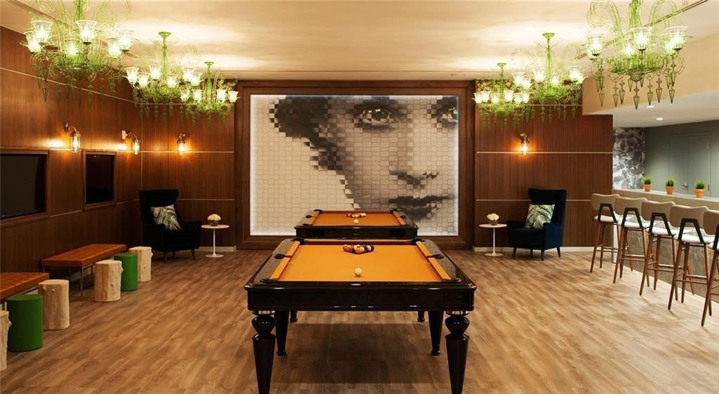 207 13th Street Northeast, Unit S2 Atlanta, GA 30309 - Photo 13 of 46 a room with furniture and wooden floor