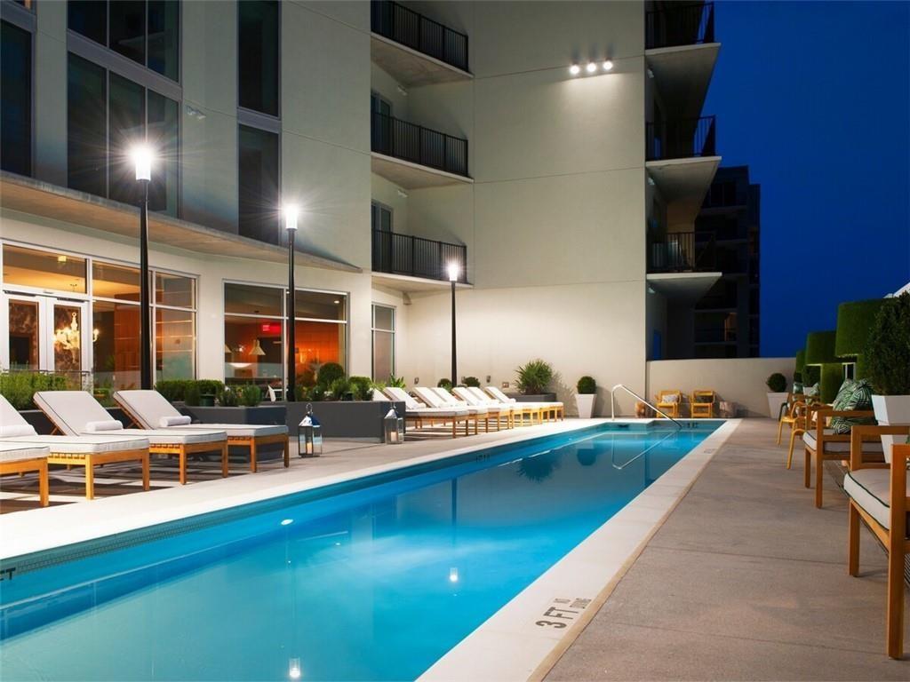 207 13th Street Northeast, Unit S2 Atlanta, GA 30309 - Photo 16 of 46 a kitchen with table and chairs