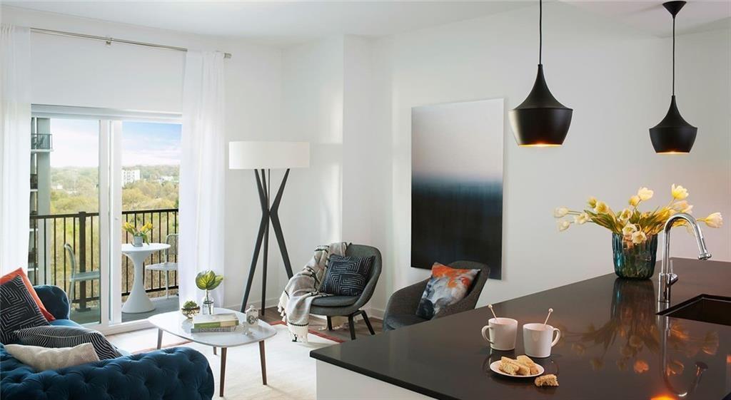 207 13th Street Northeast, Unit S2 Atlanta, GA 30309 - Photo 22 of 46 a living room with furniture and a window