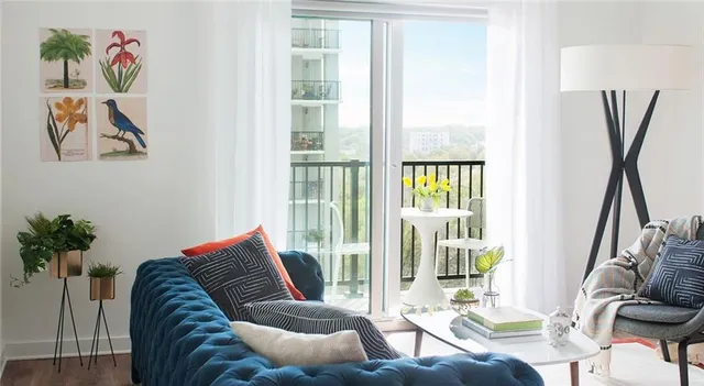 a living room with furniture and a window