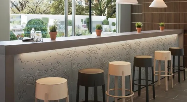 a large dining space with furniture a chandelier and window