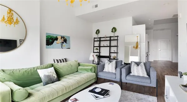 a bedroom with a bed and a lamp