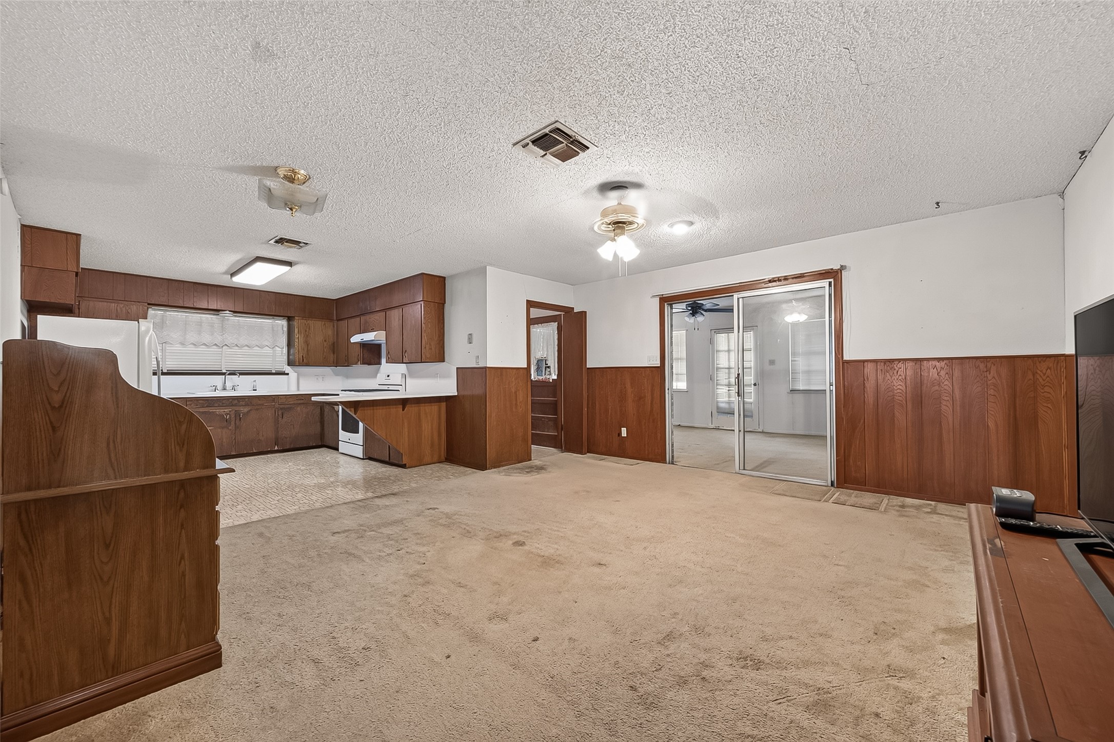 11105 Needville Fairchilds Road Needville, TX 77461 - Photo 6 of 24 a large kitchen with cabinets and a stove