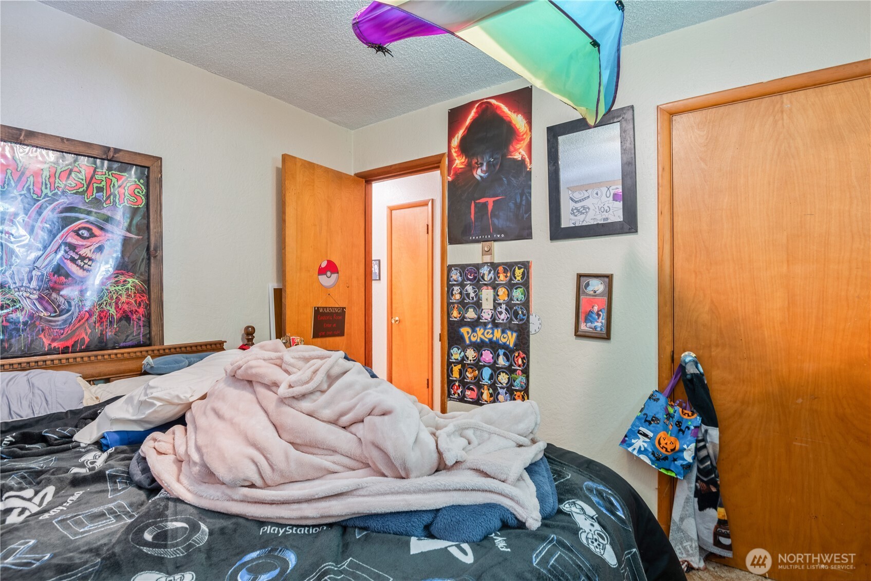 1016 Oak Street Kelso, WA 98626 - Photo 15 of 24 a bedroom with a bed and wooden floor