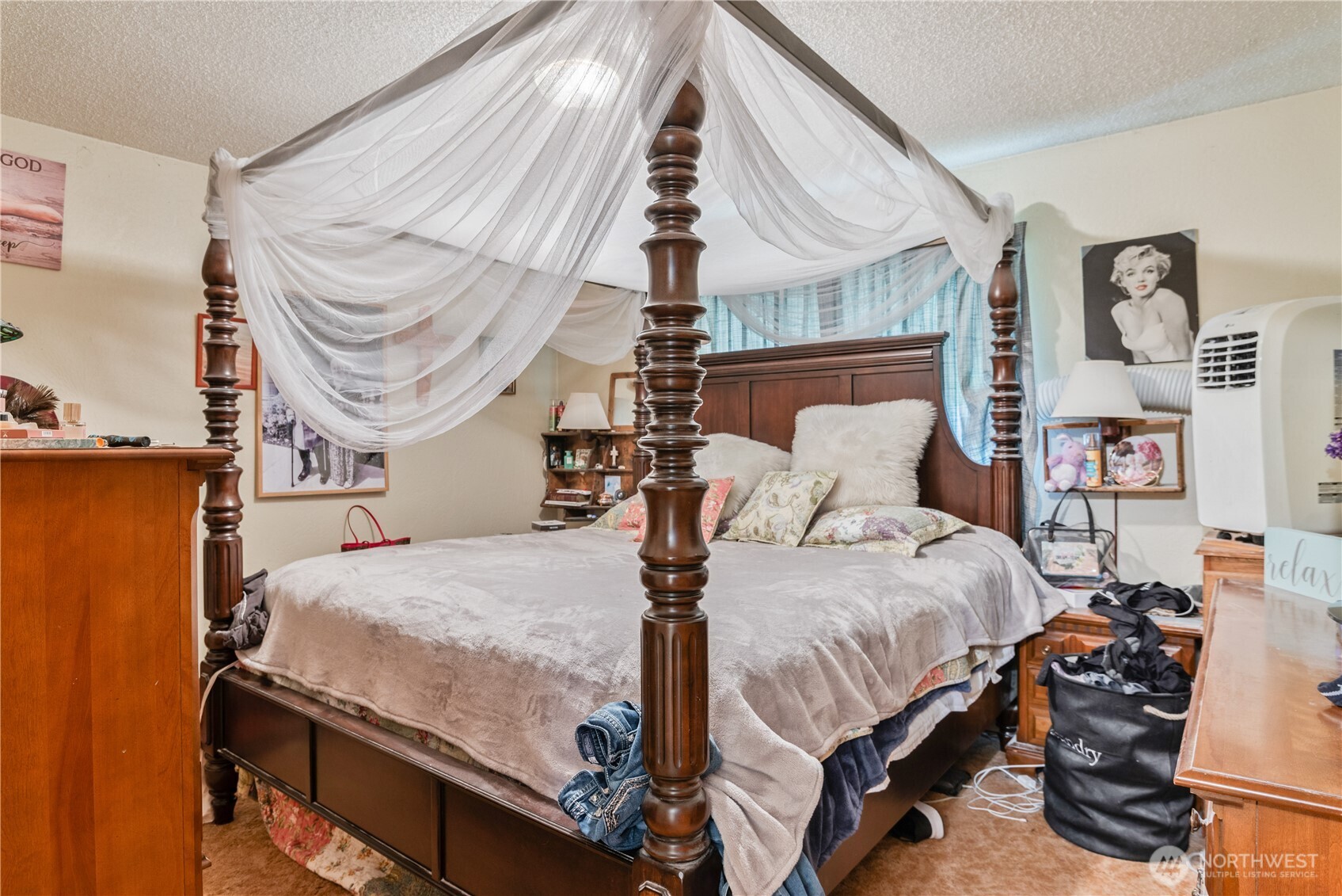 1016 Oak Street Kelso, WA 98626 - Photo 17 of 24 a bedroom with bed and a chandelier
