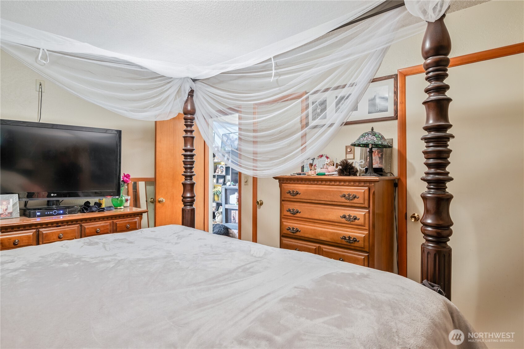 1016 Oak Street Kelso, WA 98626 - Photo 18 of 24 a bedroom with a bed and a flat screen tv