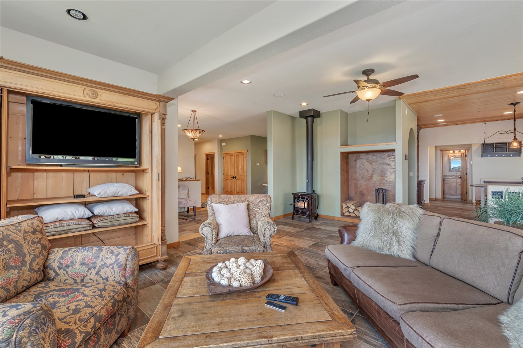 31485 Deerwood Ranch Road Steamboat Springs, CO 80487 - Photo 19 of 49 a living room with furniture and a flat screen tv