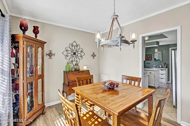 a living room with furniture a rug and wooden floor
