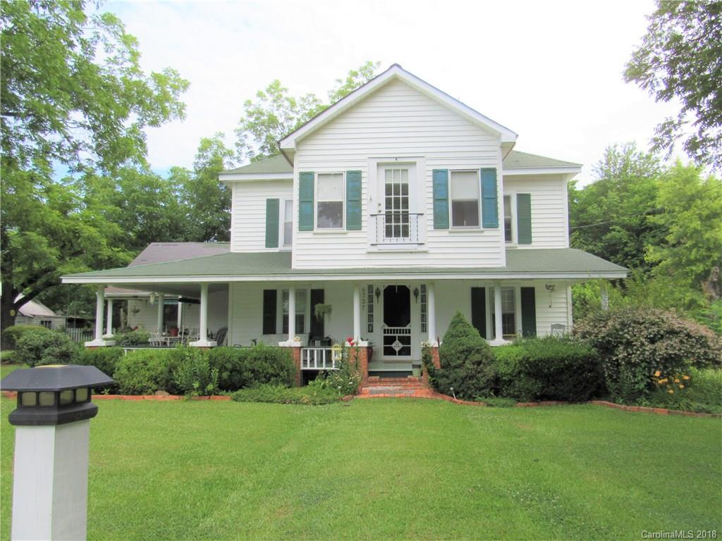 6737 Shiloh Unity Road Lancaster, SC 29720 - Photo 1 of 33 a view of a house with couches chairs and potted plants
