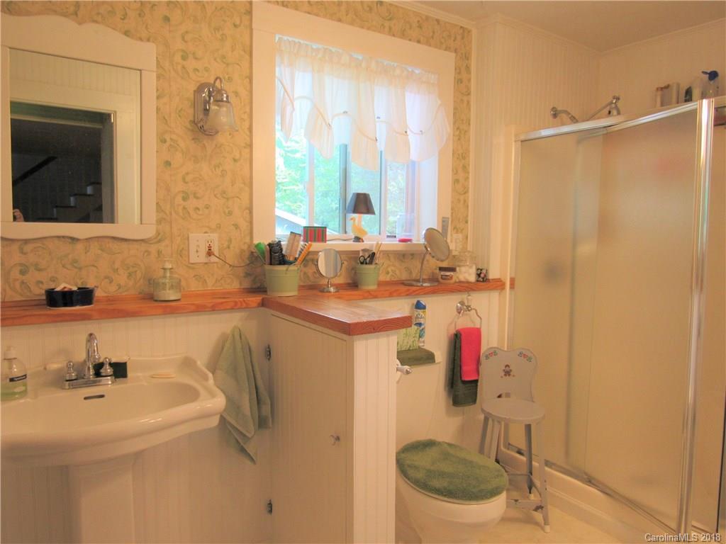 6737 Shiloh Unity Road Lancaster, SC 29720 - Photo 14 of 33 a bathroom with a sink toilet mirror and tub