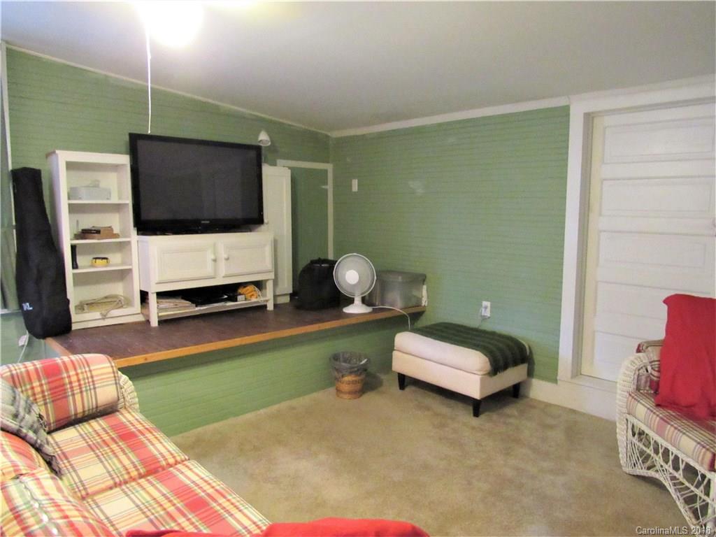 6737 Shiloh Unity Road Lancaster, SC 29720 - Photo 16 of 33 a bedroom with furniture and a flat screen tv
