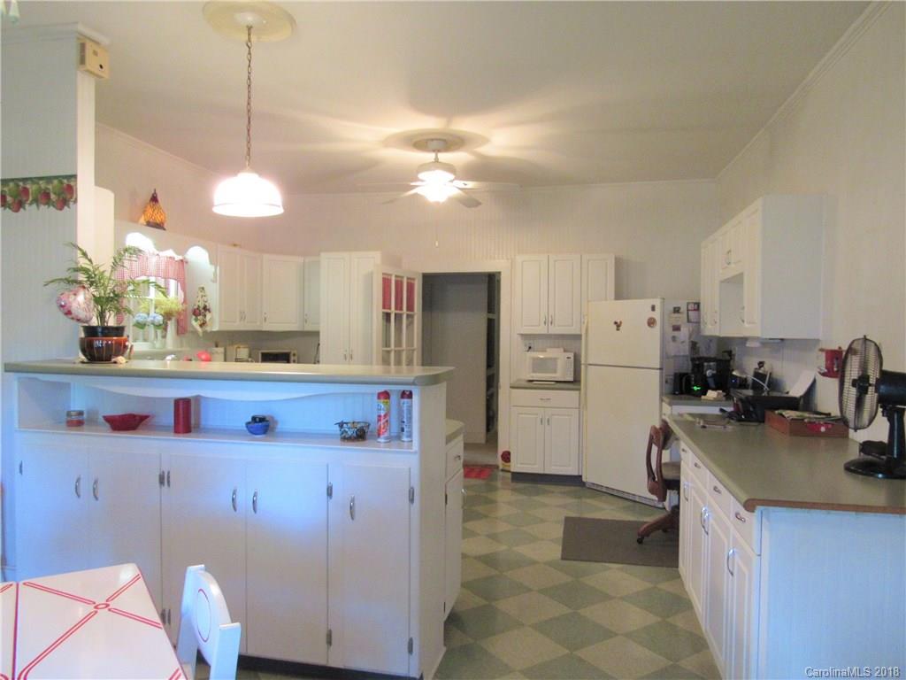 6737 Shiloh Unity Road Lancaster, SC 29720 - Photo 3 of 33 a kitchen with refrigerator and stove