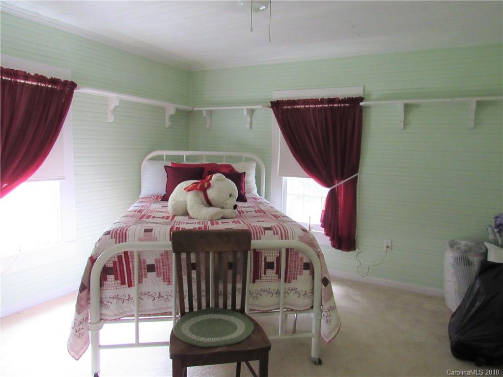 6737 Shiloh Unity Road Lancaster, SC 29720 - Photo 22 of 33 a view of a dining room with furniture and chandelier