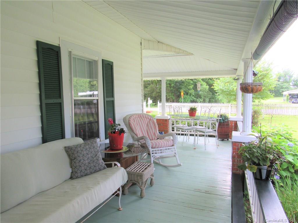 6737 Shiloh Unity Road Lancaster, SC 29720 - Photo 26 of 33 a living room with furniture and a floor to ceiling window