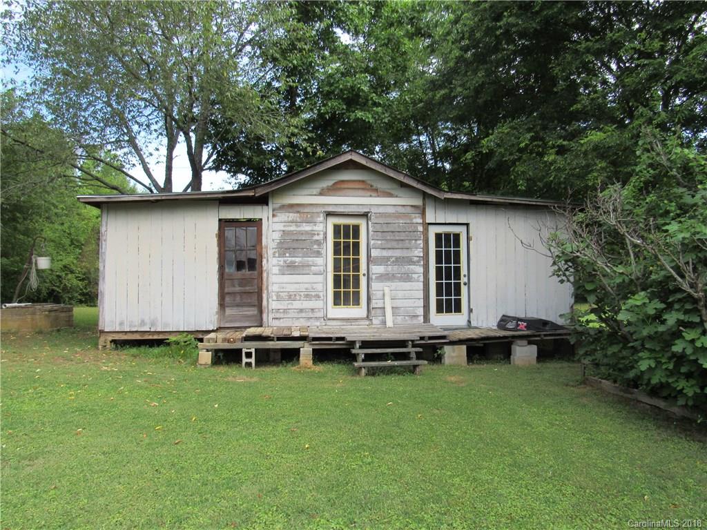 6737 Shiloh Unity Road Lancaster, SC 29720 - Photo 29 of 33 a backyard of a house with wooden deck and barbeque oven