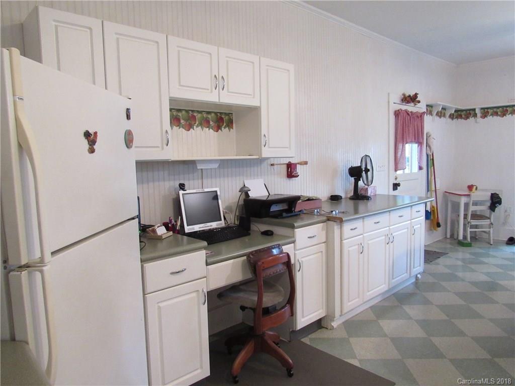 6737 Shiloh Unity Road Lancaster, SC 29720 - Photo 5 of 33 a kitchen with stainless steel appliances a sink a stove a refrigerator and cabinets