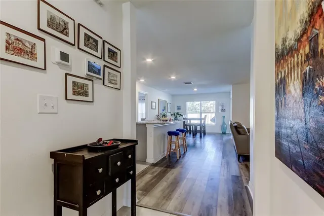 a view of a workspace with furniture and wooden floor