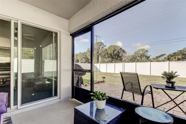 a backyard of a house with yard fire pit and outdoor seating
