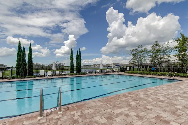 a view of outdoor space with playground and green space