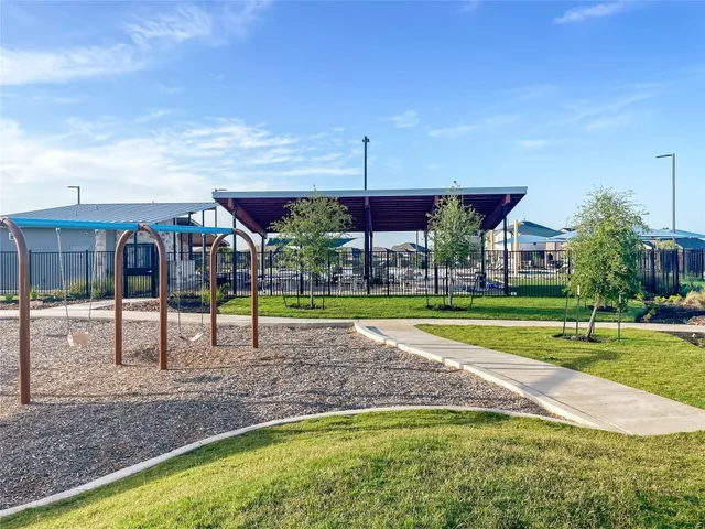 a view of a patio with a table and chairs