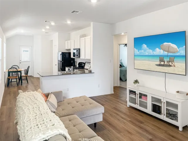 a kitchen with a refrigerator stove and sink