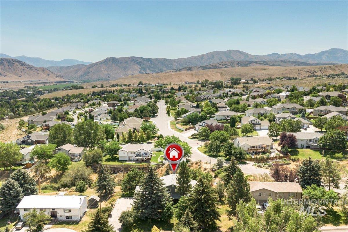 1401 Chokecherry Drive Pocatello, ID 83204 - Photo 42 of 46 Expansive neighborhood with diverse residential architecture and mature trees, surrounded by distant mountains