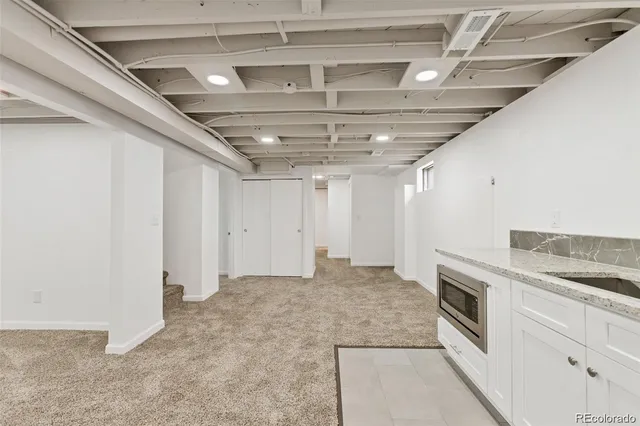 a view of a hallway with washer and dryer