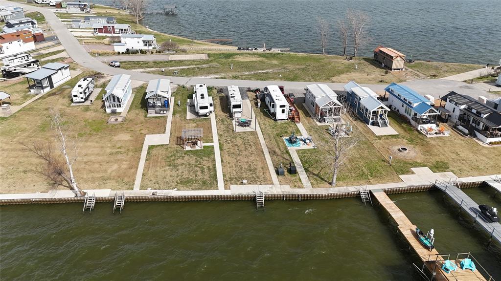 6454 Peninsula Road Kerens, TX 75144 - Photo 20 of 40 a view of a swimming pool with a yard
