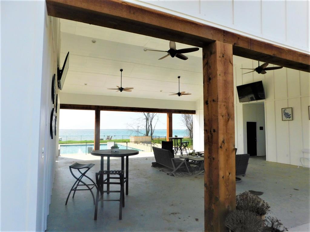 6454 Peninsula Road Kerens, TX 75144 - Photo 29 of 40 a dining room with furniture and a window