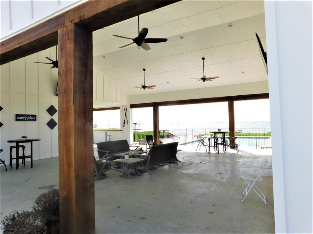 6454 Peninsula Road Kerens, TX 75144 - Photo 30 of 40 a living room with furniture and a large window
