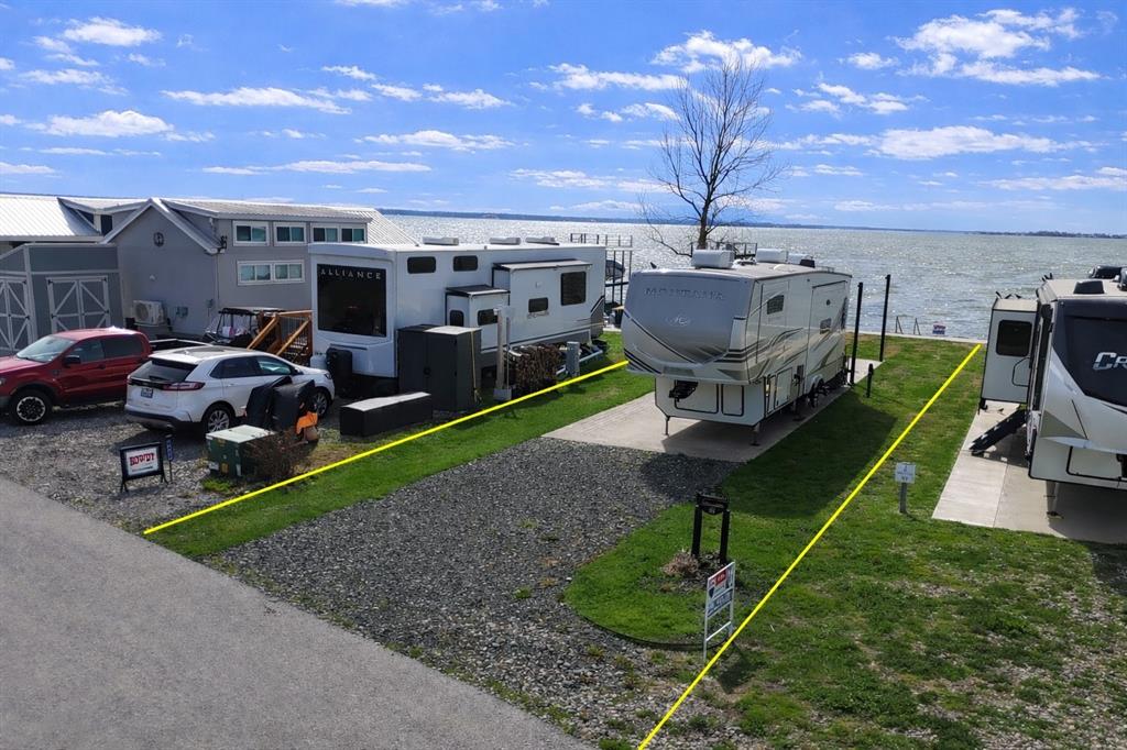 6454 Peninsula Road Kerens, TX 75144 - Photo 4 of 40 a view of a backyard with lawn chairs