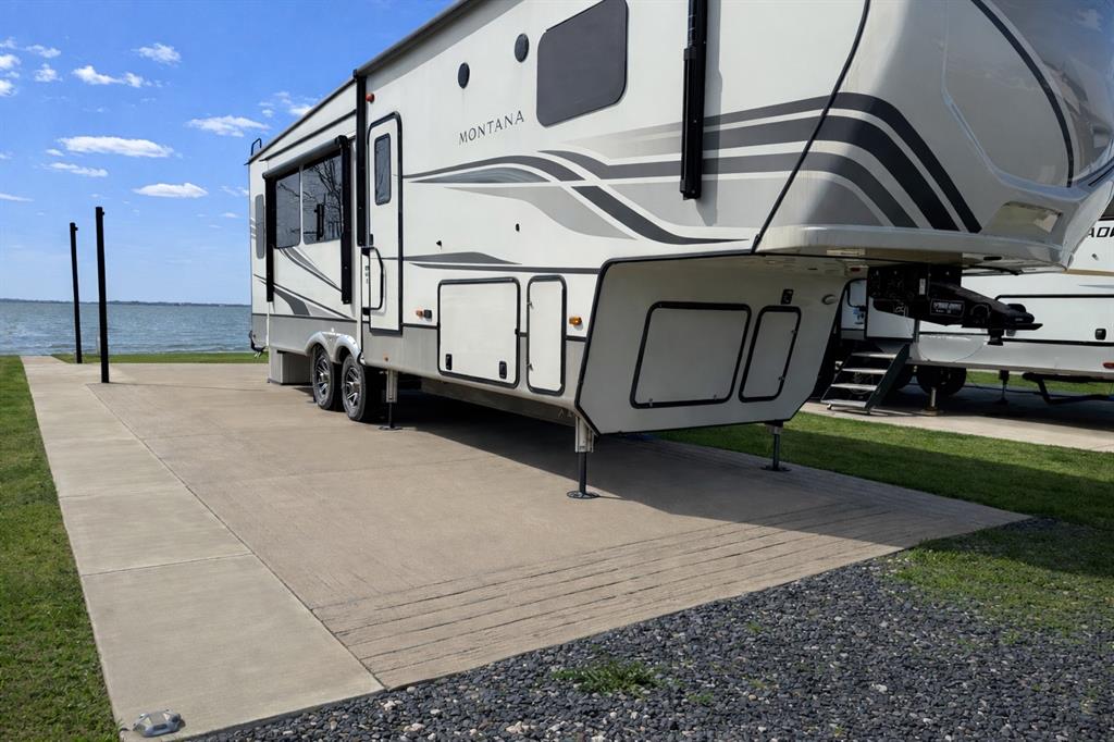 6454 Peninsula Road Kerens, TX 75144 - Photo 7 of 40 a view of an chairs and tables in the patio
