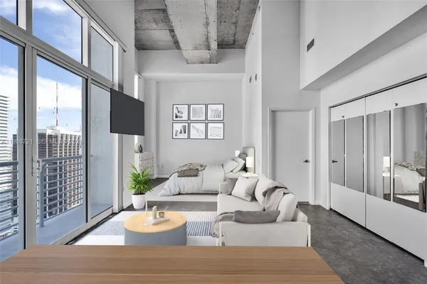 a kitchen with stainless steel appliances white cabinets and a refrigerator