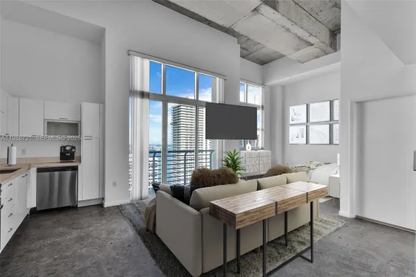 a view of a big room with windows and closet