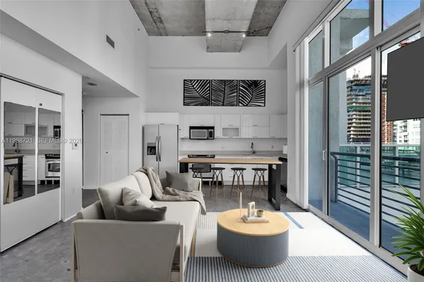 a view of a kitchen with furniture and a window