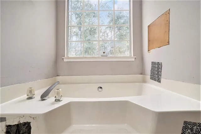 a workspace with furniture window and wooden floor