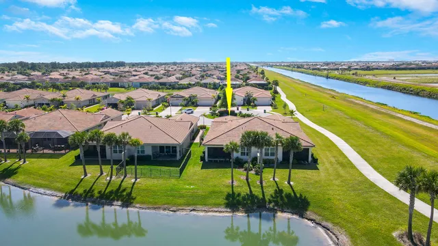 an entryway with wooden floor and cabinet