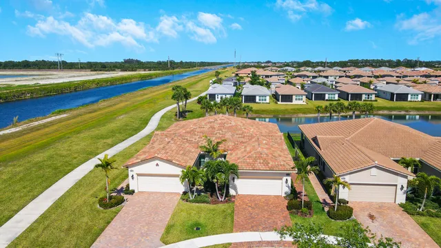 a view of a dining room with furniture wooden floor and chandelier