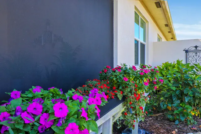 a kitchen with stainless steel appliances granite countertop a kitchen island a stove and a refrigerator