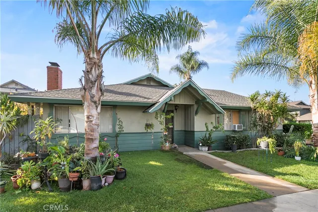 a front view of house with yard and outdoor seating