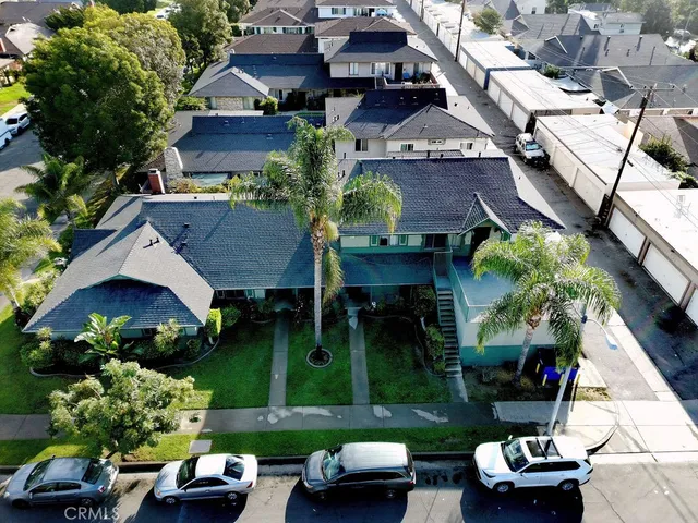 an aerial view of a house with a garden and plants