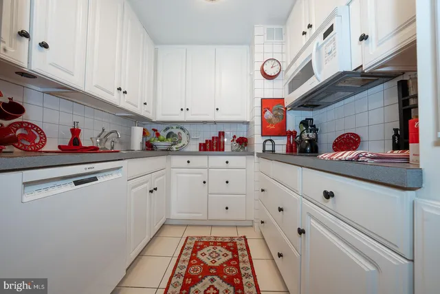 a kitchen with stainless steel appliances granite countertop a sink and dishwasher