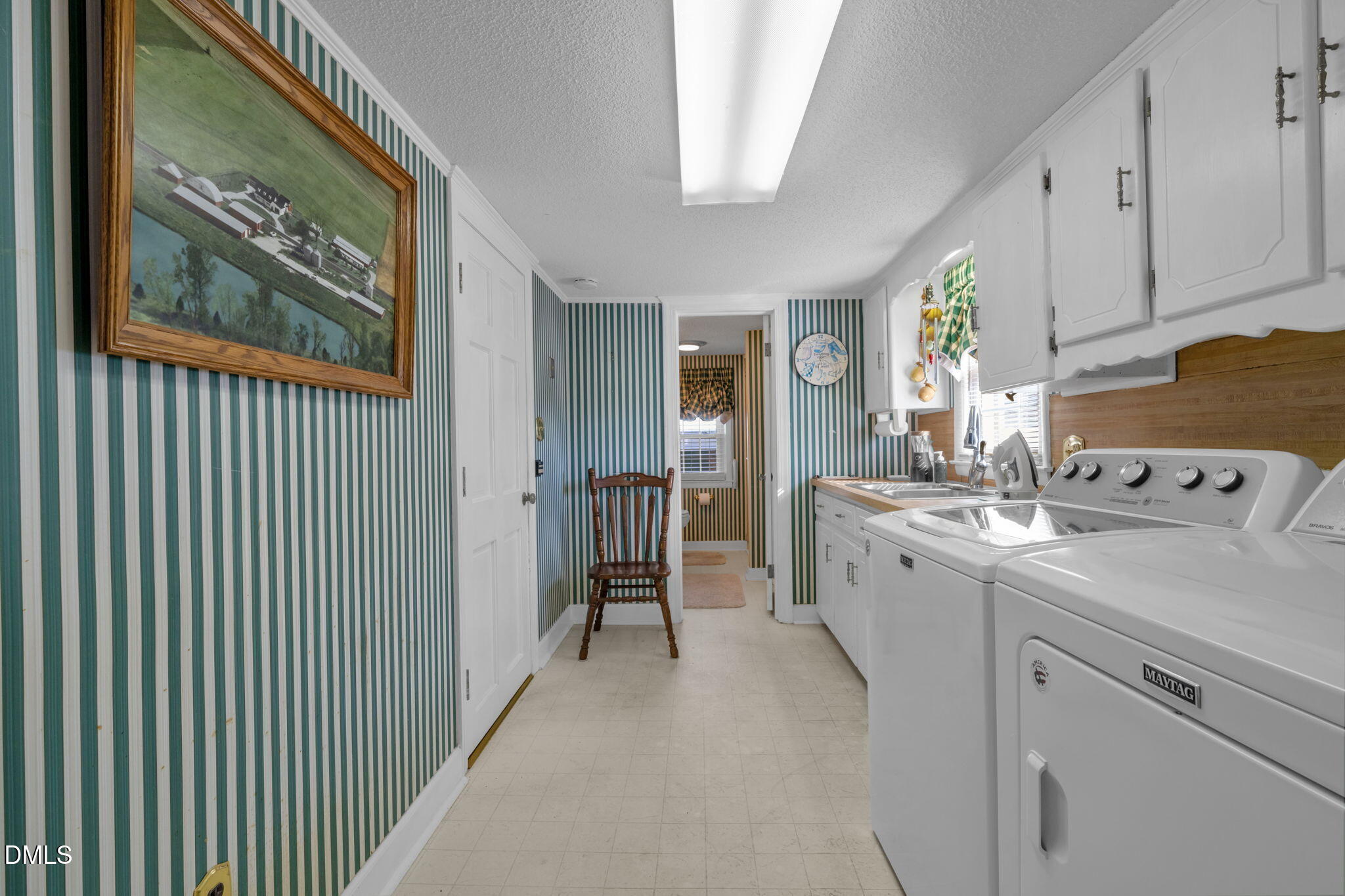 401 Allens Crossroads Road Four Oaks, NC 27524 - Photo 15 of 64 a view of a kitchen with cabinets