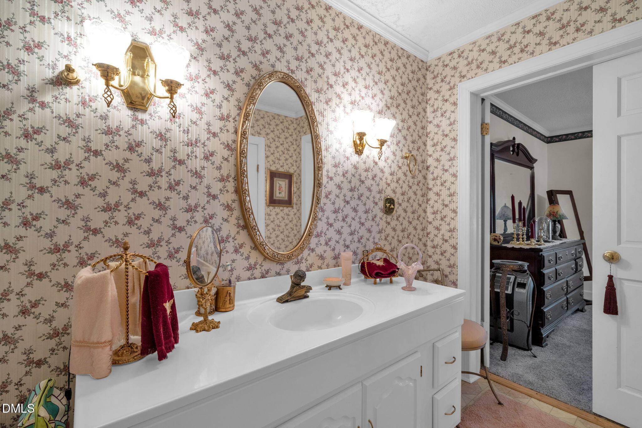 401 Allens Crossroads Road Four Oaks, NC 27524 - Photo 20 of 64 a bathroom with a sink and a mirror