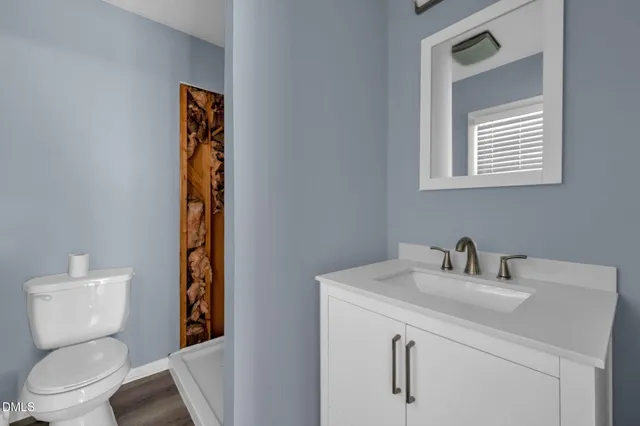 a view of a backyard with sitting area