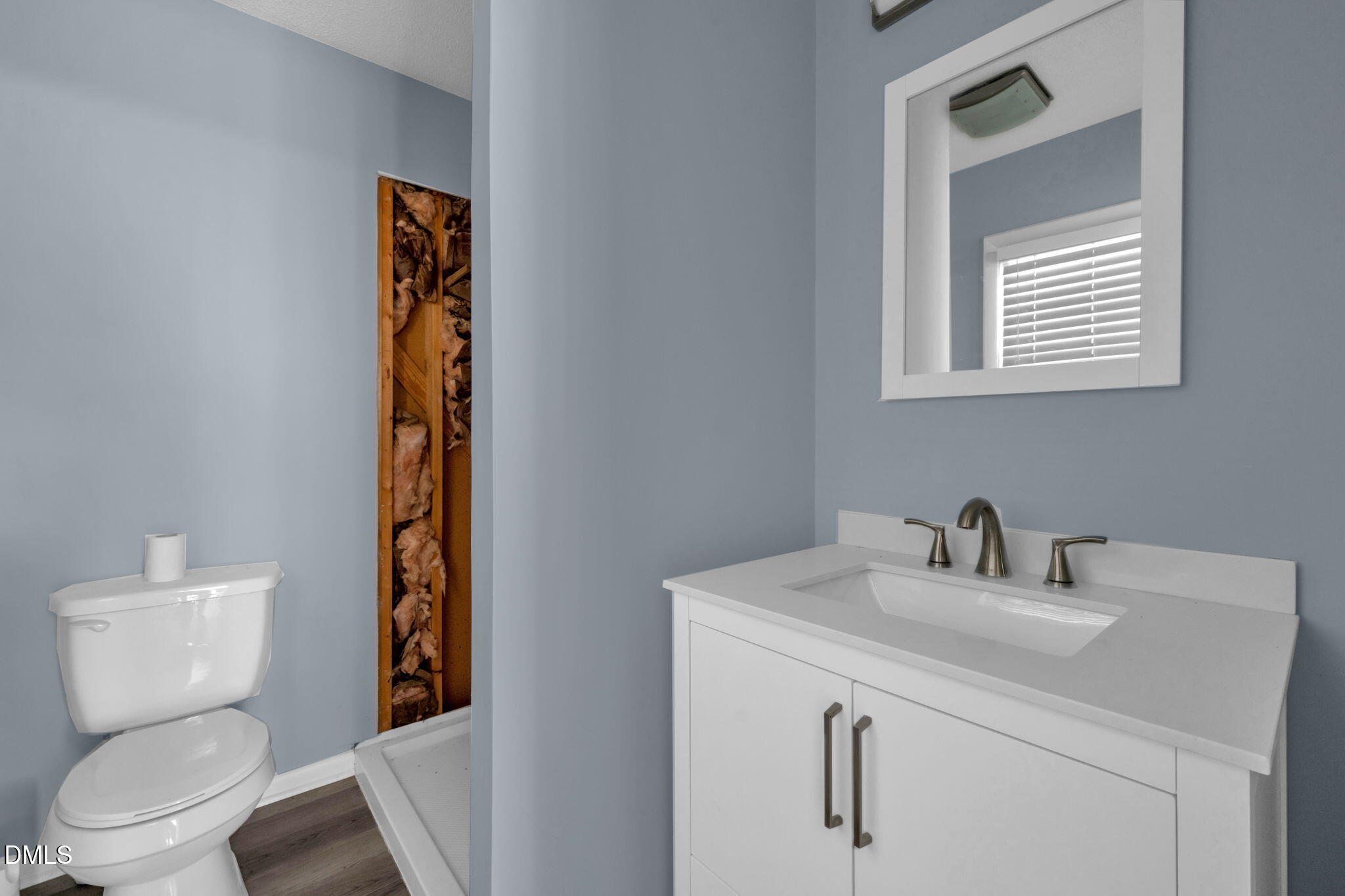 401 Allens Crossroads Road Four Oaks, NC 27524 - Photo 26 of 64 a bathroom with a toilet sink and mirror