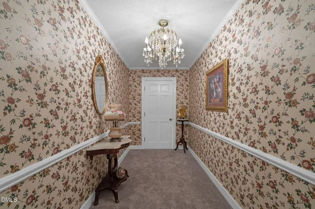 a view of a patio with table and chairs with wooden floor and fence